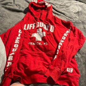 Red lifeguard sweater